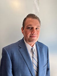Headshot of Adam Ekbom